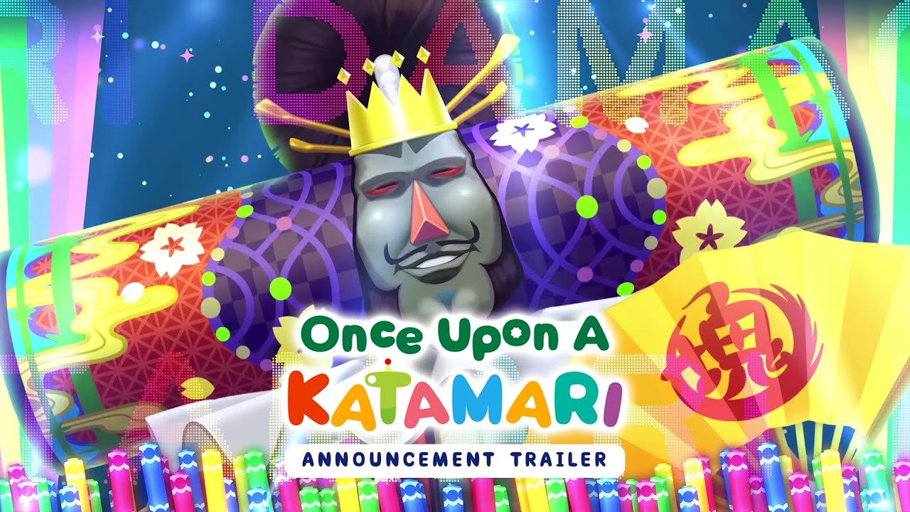 Imagem colorida do trailer de anúncio de 'Once Upon A Katamari', com o Rei do Cosmos, personagem principal da franquia, ao centro. Ele está usando uma coroa e rodeado por padrões vibrantes e elementos gráficos, como tubos coloridos e uma leque com símbolos japoneses. O nome do jogo aparece em letras grandes e coloridas no centro da imagem, com o texto 'Anúncio Trailer' abaixo.