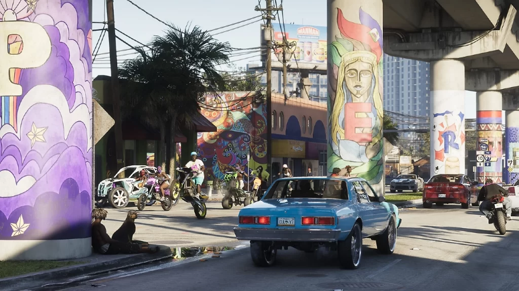 Cena urbana vibrante de GTA VI com carros, motos e grafites coloridos sob um viaduto, representando o clima caótico e cultural da cidade fictícia inspirada em Miami.
