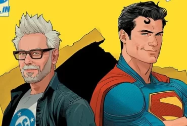 Ilustração em estilo de quadrinhos mostrando James Gunn ao lado do Superman. Gunn aparece com cabelos brancos, barba e óculos, vestindo camiseta da DC e jaqueta aberta. Superman está sorridente, de braços cruzados, usando seu traje clássico azul e capa vermelha, com o icônico “S” no peito. O fundo é amarelo vibrante com detalhes gráficos em preto.