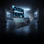 Notebook gamer GIGABYTE Gaming A16 com GeForce RTX série 50 exibido em ambiente futurista, destacando design moderno e teclado retroiluminado.