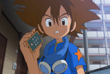Tai Kamiya segurando um dispositivo em Digimon Adventure.