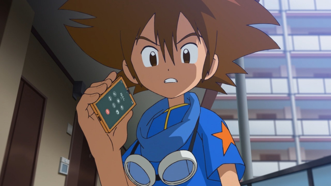 Tai Kamiya segurando um dispositivo em Digimon Adventure.