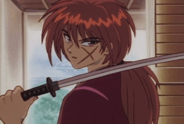 Kenshin Himura com sua katana, o ex-retalhador em busca de redenção no anime Samurai X.