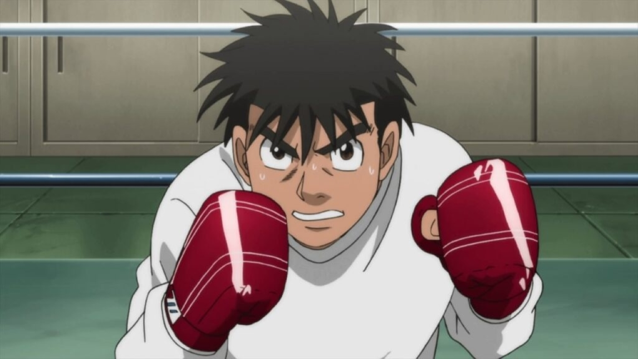 Makunouchi Ippo treinando com luvas vermelhas no ringue em Hajime no Ippo.
