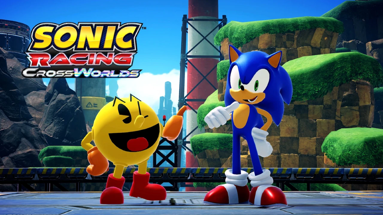 PAC-MAN e Sonic the Hedgehog lado a lado em um cenário colorido de Sonic Racing: CrossWorlds, com paisagem verde ao fundo e o logo do jogo no canto da imagem.