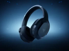 Headset gamer sem fio da Razer em cor preta, com design moderno e minimalista, apresentado sobre fundo azul com iluminação futurista.