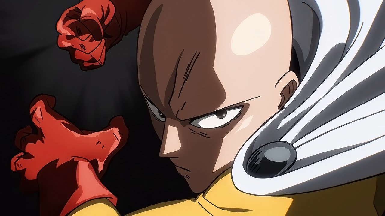 Frame da abertura de One Punch Man mostrando Saitama com luvas vermelhas, braço levantado e expressão focada, em um fundo escuro, sugerindo um golpe iminente.
