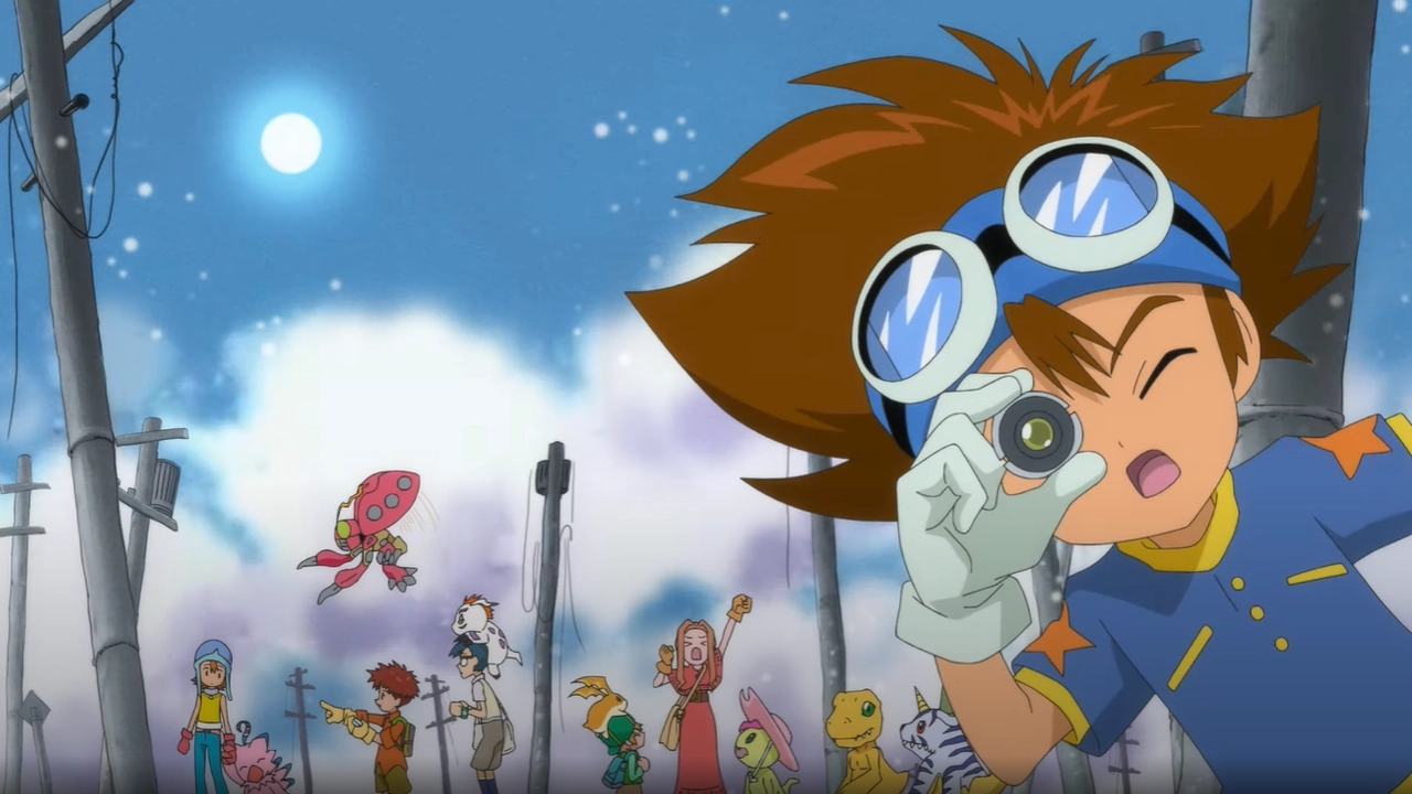 Tai (Taichi) Kamiya em primeiro plano, usando óculos de proteção na cabeça e segurando um pequeno dispositivo perto do olho, como se estivesse observando. Ao fundo aparecem os outros escolhidos e vários Digimon (incluindo Agumon), em um cenário externo à noite com lua no céu.