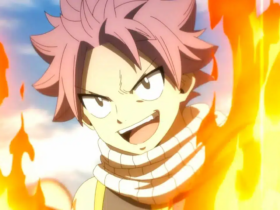 Natsu Dragneel, personagem de Fairy Tail, com expressão determinada e punho à frente, cercado por chamas alaranjadas, pronto para atacar.