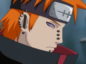 Close do personagem Pain (Nagato), de Naruto Shippuden, com cabelo laranja, olhos roxos e expressão séria, usando bandana com símbolo riscado, em um fundo acinzentado.
