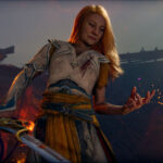 Faye em God of War Laufey segurando uma espada em cenário de batalha.