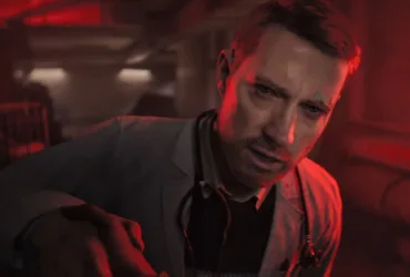 Cena do trailer de Ill mostrando o clima sombrio e gore horror do jogo