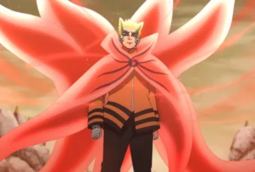 Naruto em pé no Modo Bárion, com capa e caudas de energia vermelha se abrindo atrás do corpo, expressão séria e fundo com céu alaranjado e rochas ao redor.