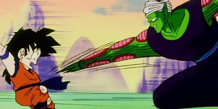 Piccolo observando Gohan criança durante um treinamento intenso em Dragon Ball Z, em um cenário isolado e hostil, simbolizando a linha delicada entre preparação, pressão e violência “educativa” nas histórias de anime.