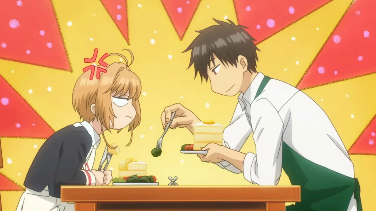 Cena de anime com Touya Kinomoto sentado à mesa, usando um avental verde, oferecendo um pedaço de brócolis com um garfo para Sakura Kinomoto, que está emburrada; o fundo é amarelo e vermelho, com clima cômico, sugerindo uma rotina doméstica onde o irmão mais velho cuida mesmo fingindo que não.