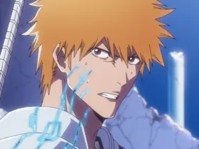 Close do Ichigo Kurosaki, com expressão séria e marcas de batalha no rosto, em um cenário destruído ao fundo, representando o arco final de Bleach: Thousand-Year Blood War – The Calamity.