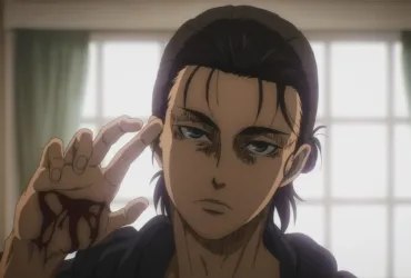 Close do personagem Eren Yeager, com expressão séria e cansada, levantando a mão com marcas de sangue enquanto encara a frente, sugerindo a transformação de alguém que jurava odiar a violência em alguém capaz de atravessar a mesma linha.
