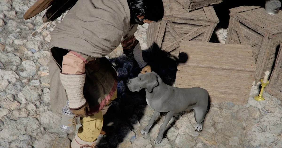 Personagem Kilff acariciando cachorro no jogo Crimson Desert